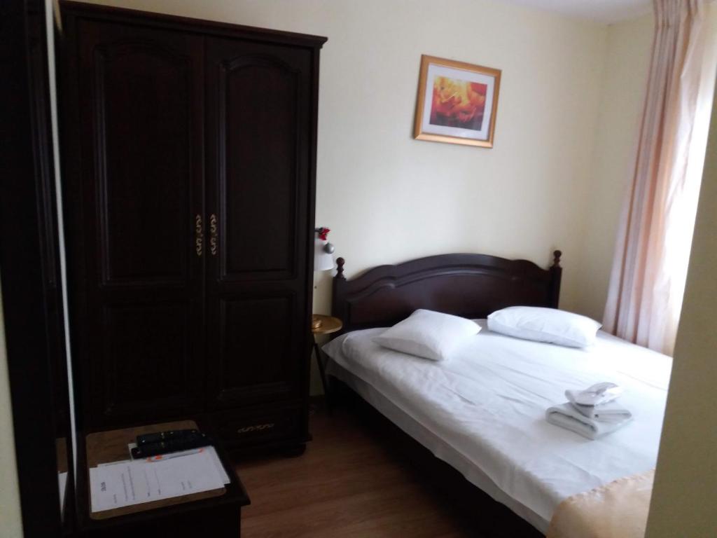 Postel nebo postele na pokoji v ubytování Vila Felix