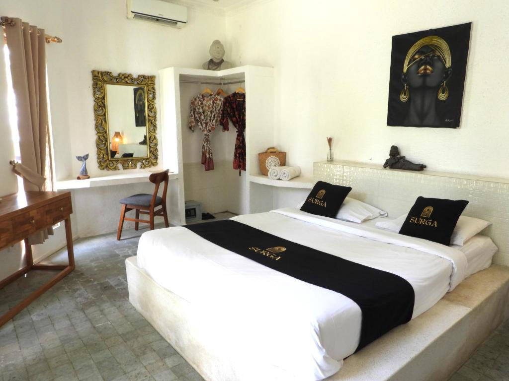 Postel nebo postele na pokoji v ubytování Surga Homestay