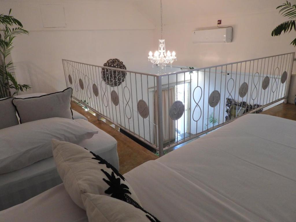 Postel nebo postele na pokoji v ubytování Surga Homestay