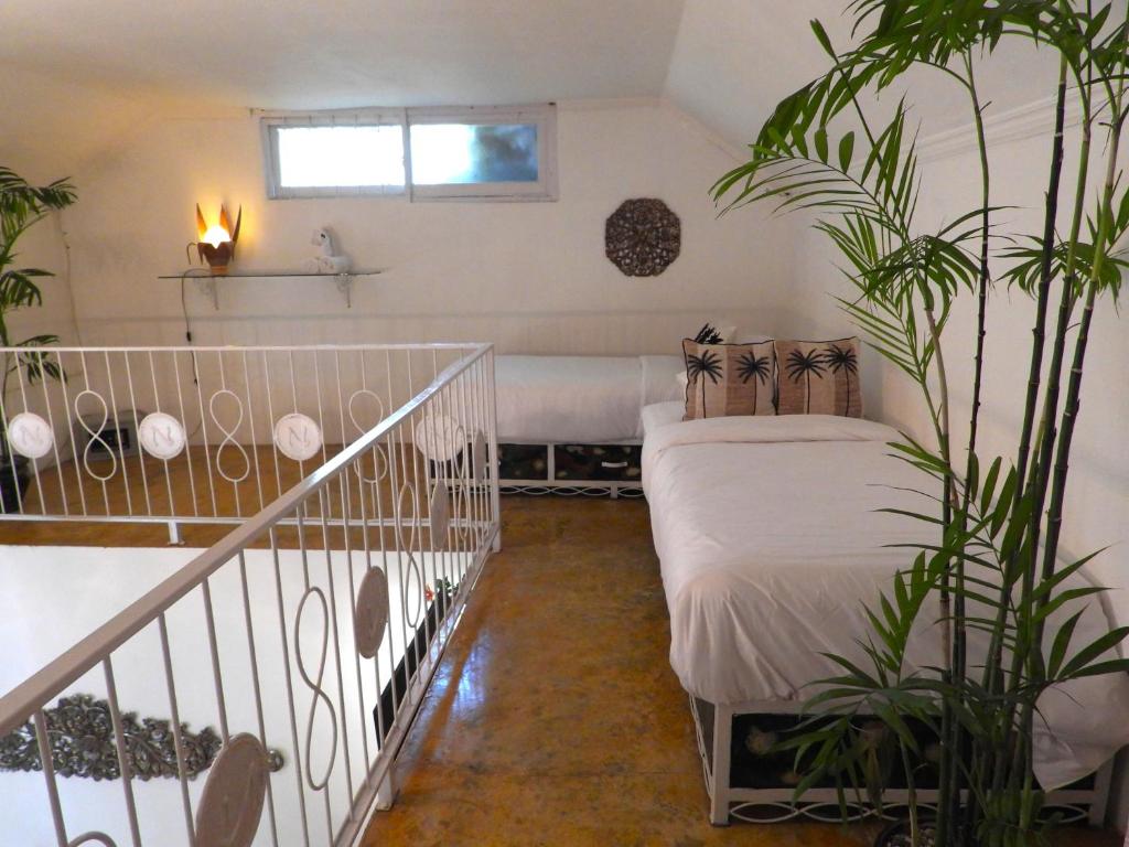 Postel nebo postele na pokoji v ubytování Surga Homestay