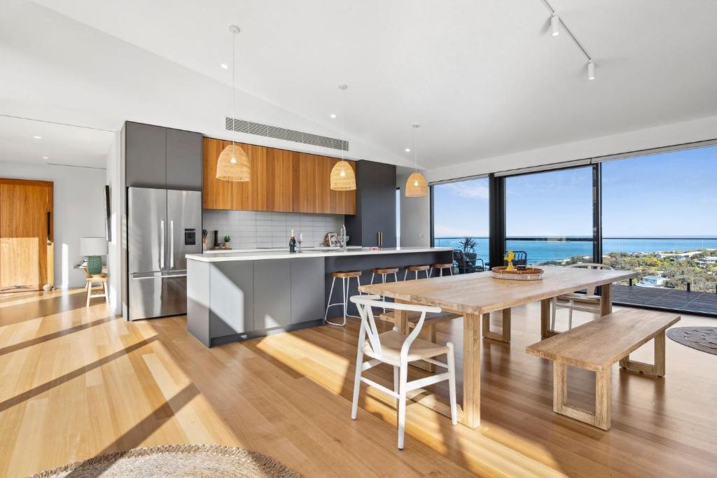 an open kitchen and dining room with a table and chairs at Hakea Ridge in Aireys Inlet