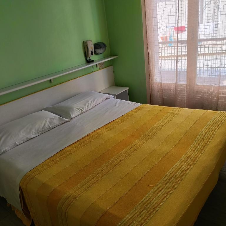 Postel nebo postele na pokoji v ubytování Hotel Raul