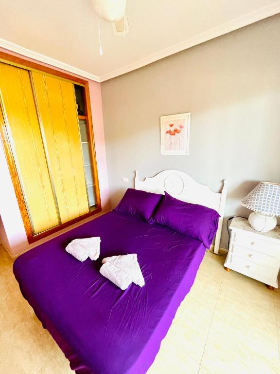 Postel nebo postele na pokoji v ubytování APARTAMENTO PALMERAL DEL MAR MENOR