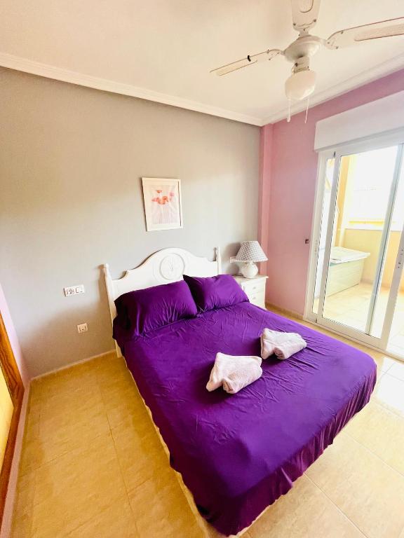 Postel nebo postele na pokoji v ubytování APARTAMENTO PALMERAL DEL MAR MENOR