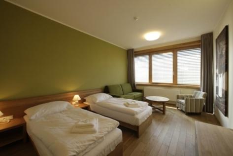 Postel nebo postele na pokoji v ubytování Hotel Madl