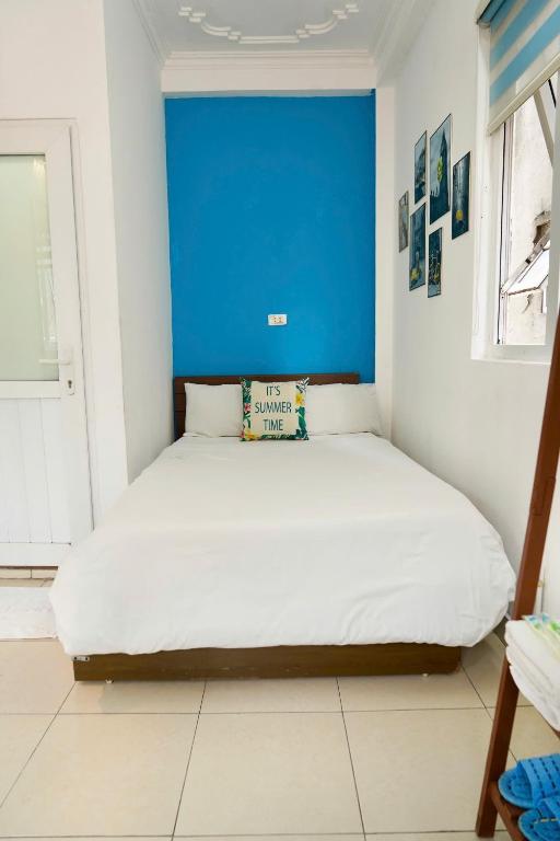 Postel nebo postele na pokoji v ubytování Bluebell Hotel