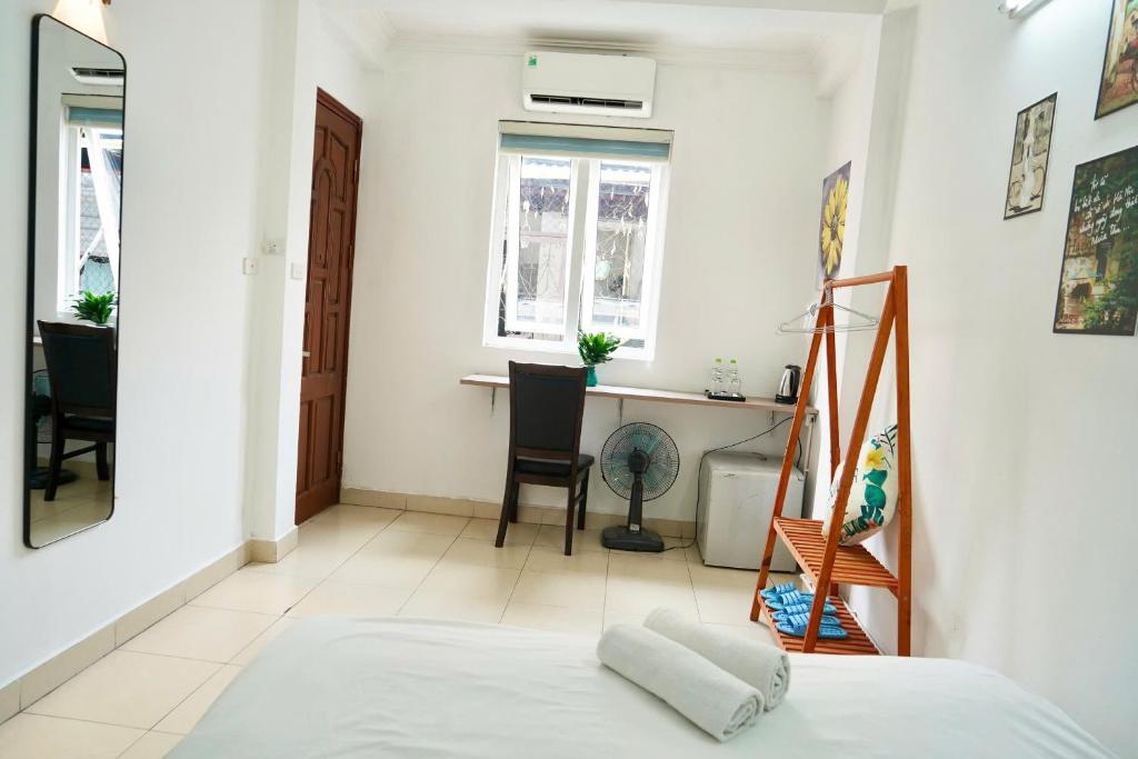 Postel nebo postele na pokoji v ubytování Bluebell Hotel