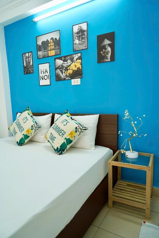 Postel nebo postele na pokoji v ubytování Bluebell Hotel