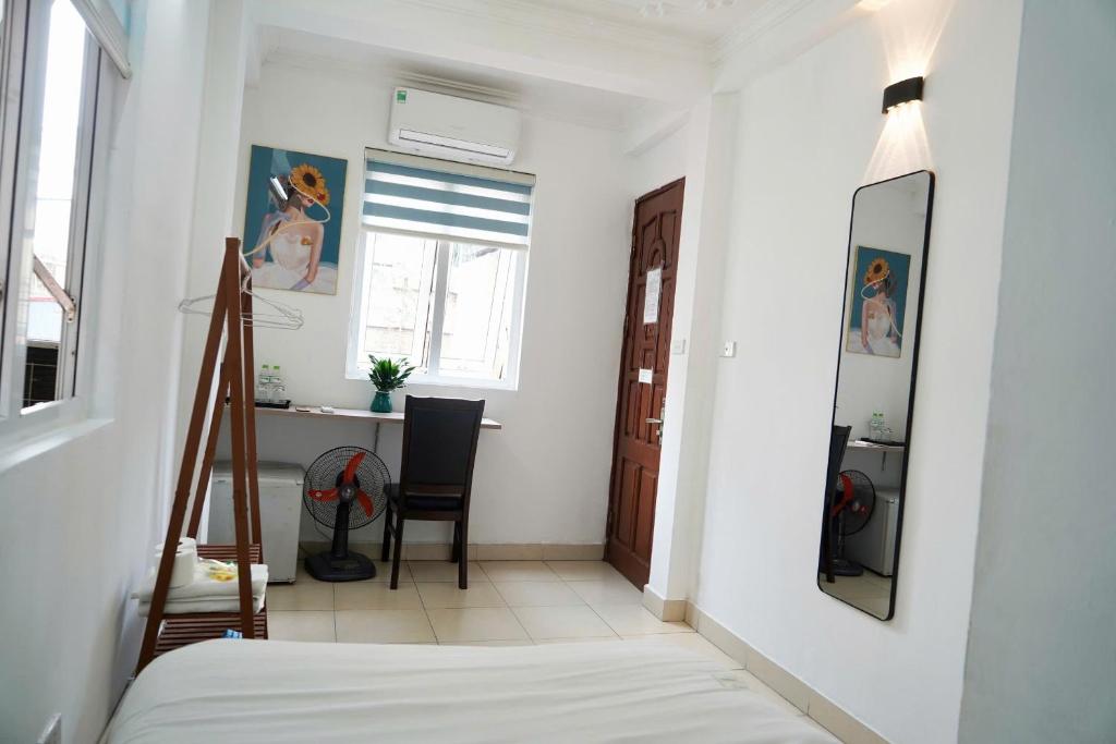 Postel nebo postele na pokoji v ubytování Bluebell Hotel