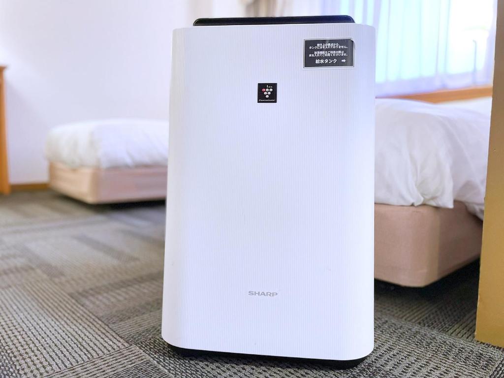 Postel nebo postele na pokoji v ubytování Hotel Castle Inn Suzuka