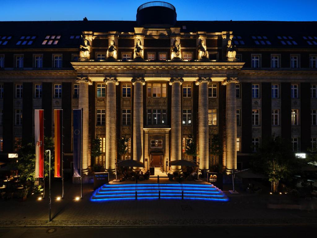 a large building with blue lights in front of it at The Wellem, in The Unbound Collection by Hyatt in Düsseldorf