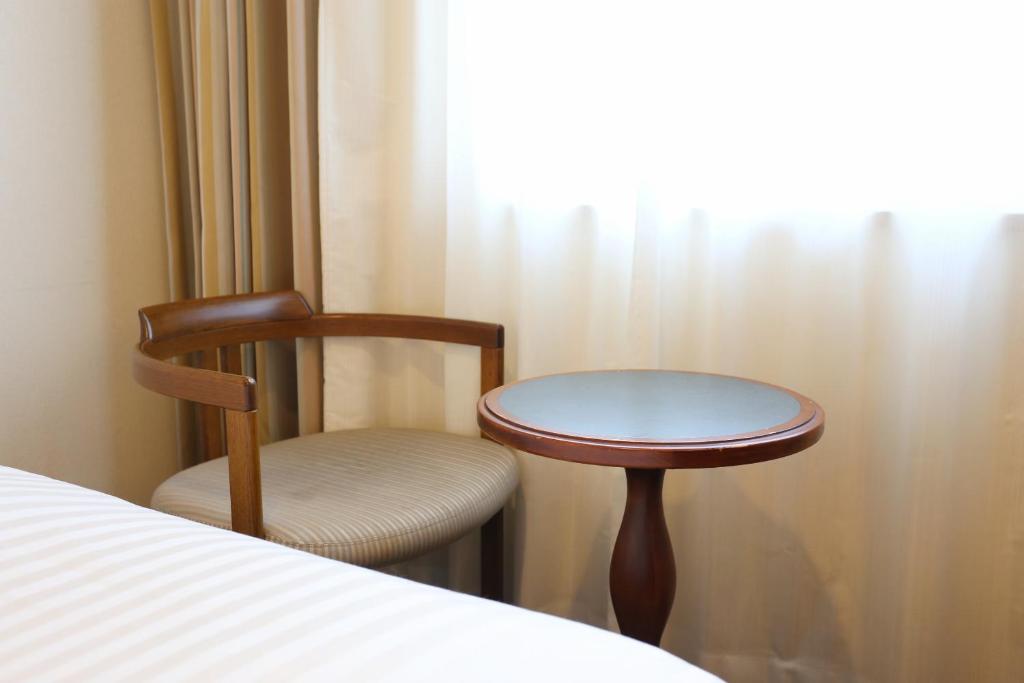 Postel nebo postele na pokoji v ubytování Hotel Castle Inn Suzuka Chuo