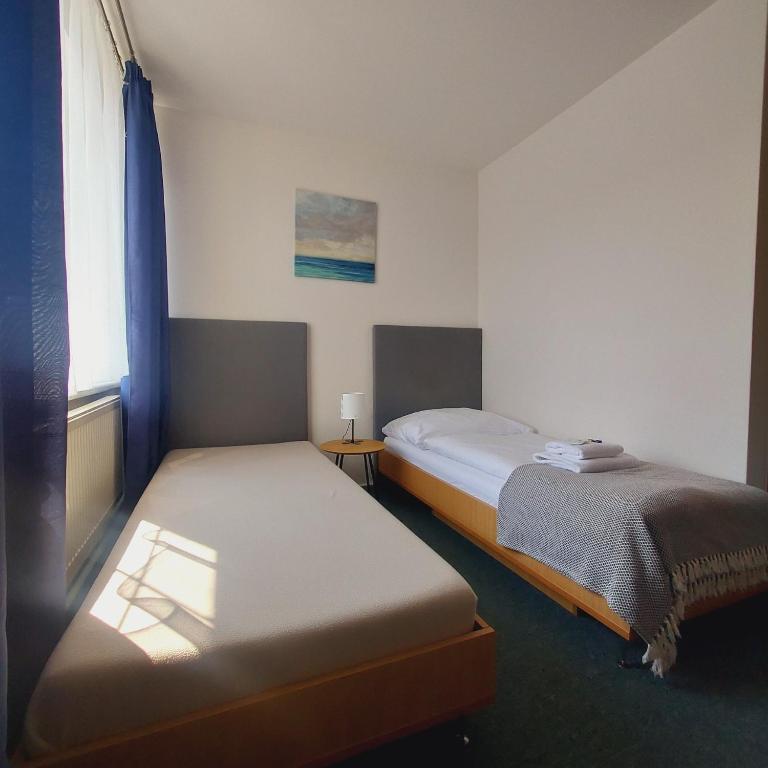 Postel nebo postele na pokoji v ubytování Garni G Hotel Žilina
