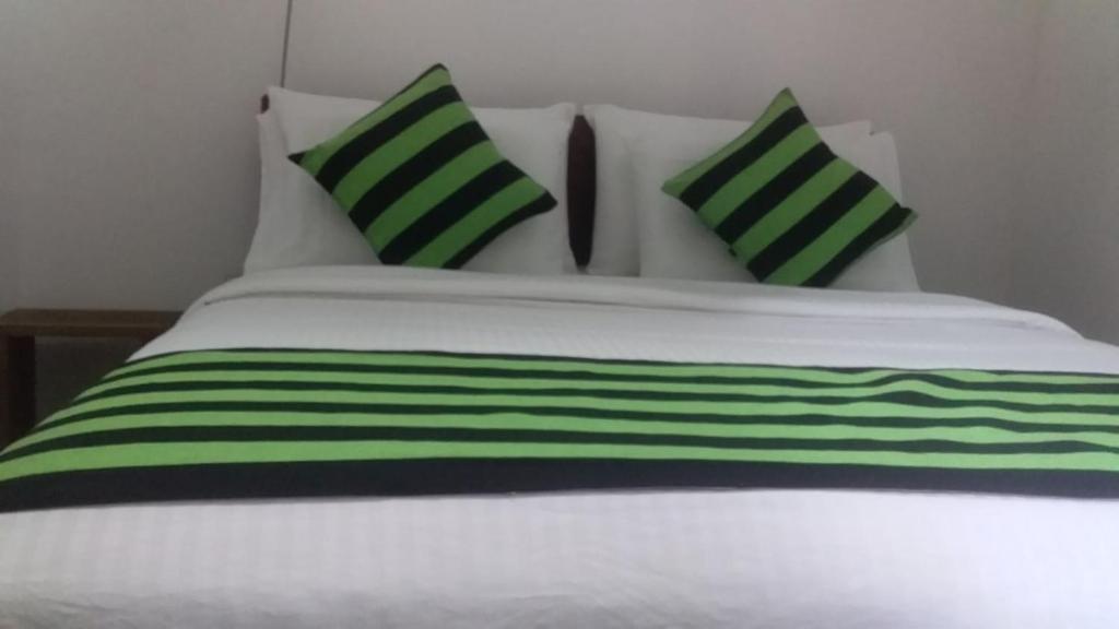 Postel nebo postele na pokoji v ubytování MUM Jungle Inn