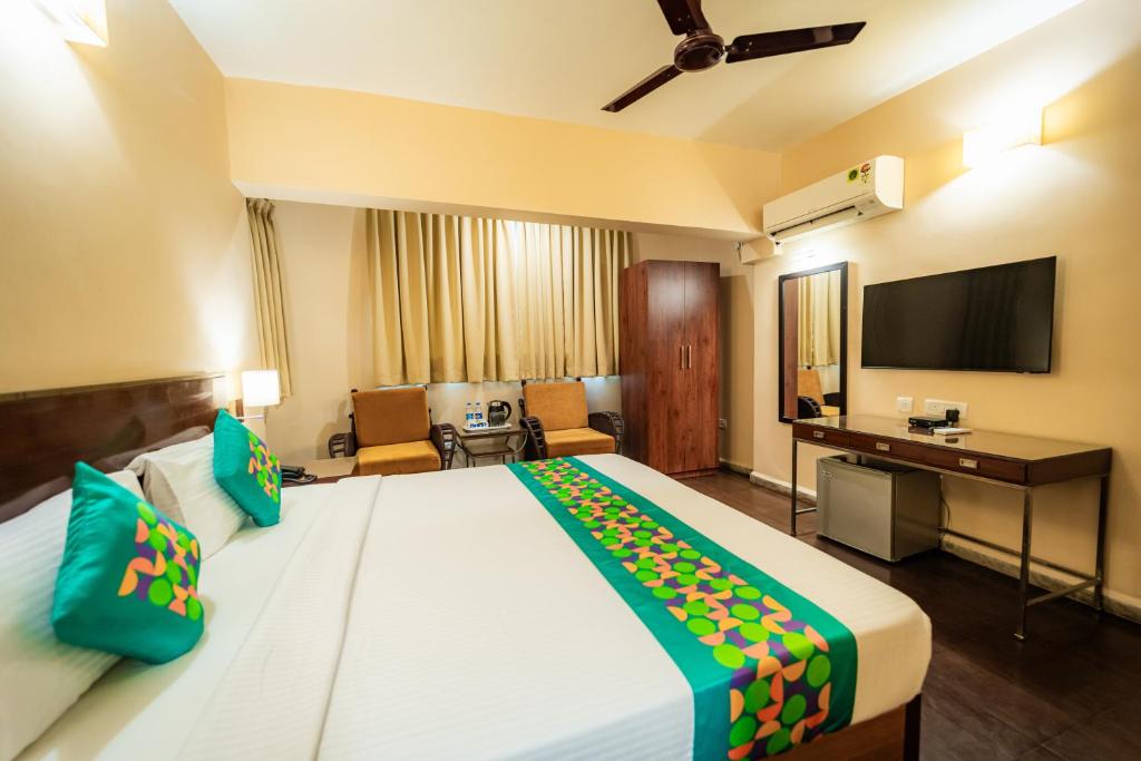 Postel nebo postele na pokoji v ubytování Treebo Sunshine Beach Resort