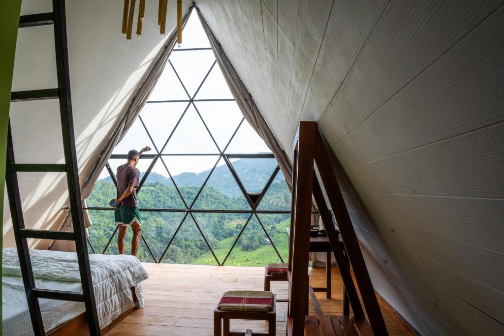 Postel nebo postele na pokoji v ubytování Eco Vibe Resort