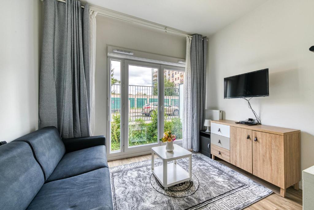 TV a/nebo společenská místnost v ubytování Moulin à Vent A01 - Studio à 200m du canal