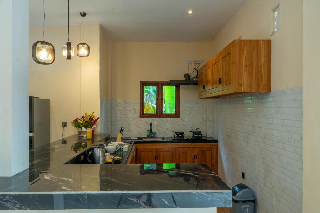 Kuchyň nebo kuchyňský kout v ubytování Baran Swaha Villa