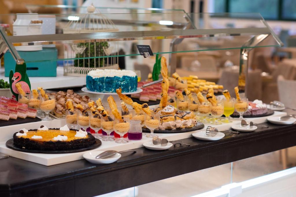 a buffet with many different types of desserts and cakes at Valentin Son Bou in Son Bou
