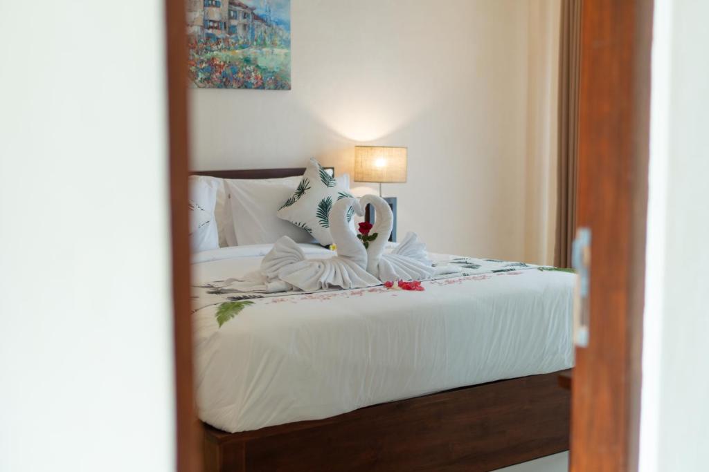 Postel nebo postele na pokoji v ubytování Baran Swaha Villa