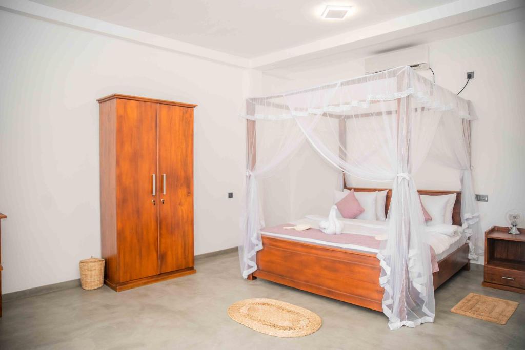 Postel nebo postele na pokoji v ubytování Hirigala Beach Resort