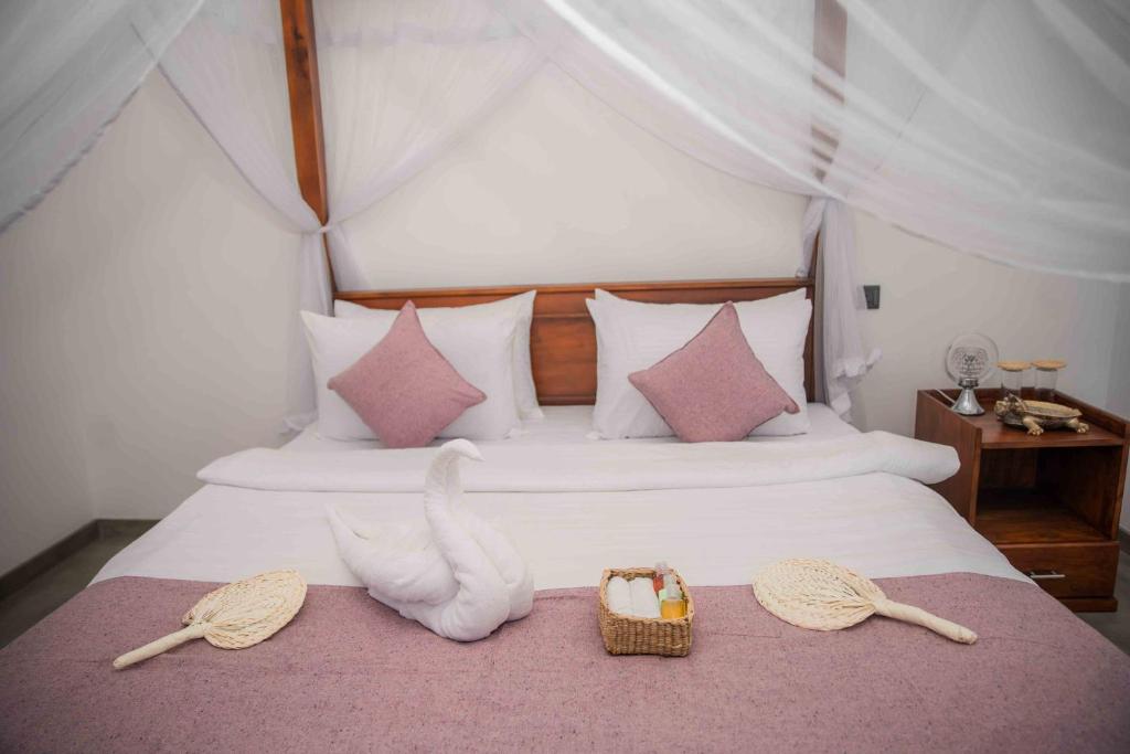 Postel nebo postele na pokoji v ubytování Hirigala Beach Resort