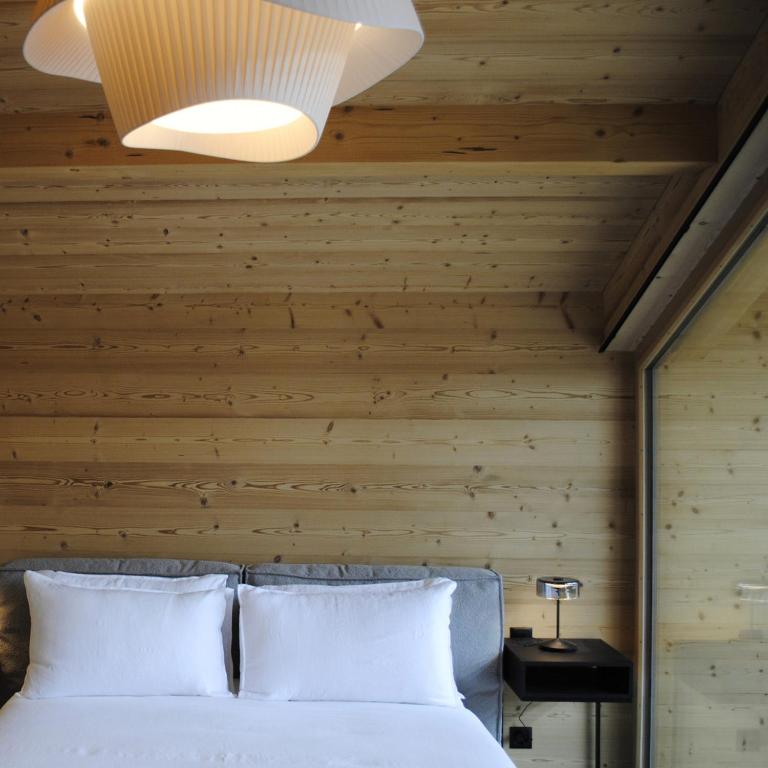 Postel nebo postele na pokoji v ubytování Boutique Hotel Casa Giovanoli