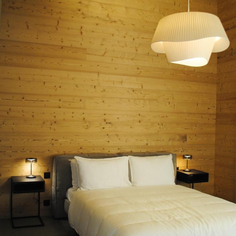 Postel nebo postele na pokoji v ubytování Boutique Hotel Casa Giovanoli