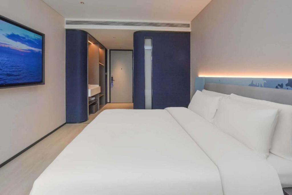 Ένα ή περισσότερα κρεβάτια σε δωμάτιο στο Atour Light Hotel Nanjing South Railway Station South Square