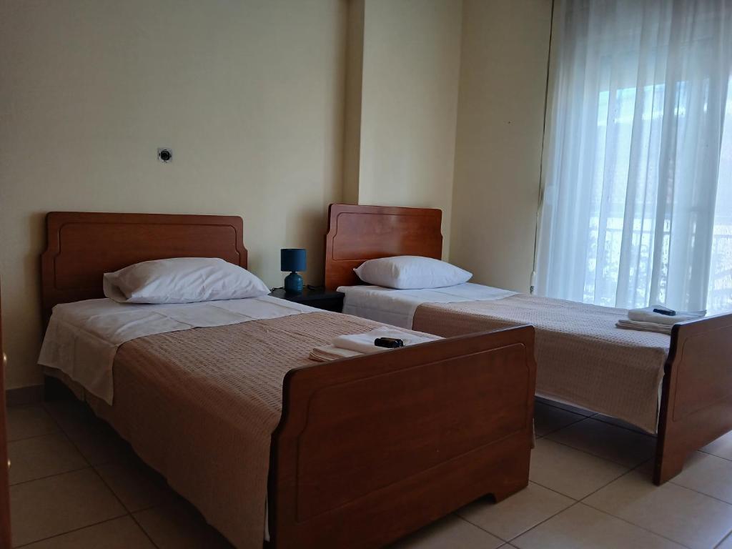 Postel nebo postele na pokoji v ubytování Ananias house