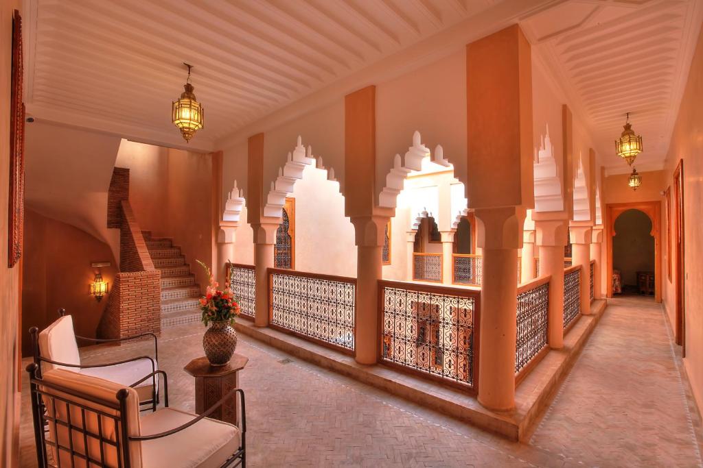 a hallway of a building with a balcony at Dar Tasnime in Marrakesh