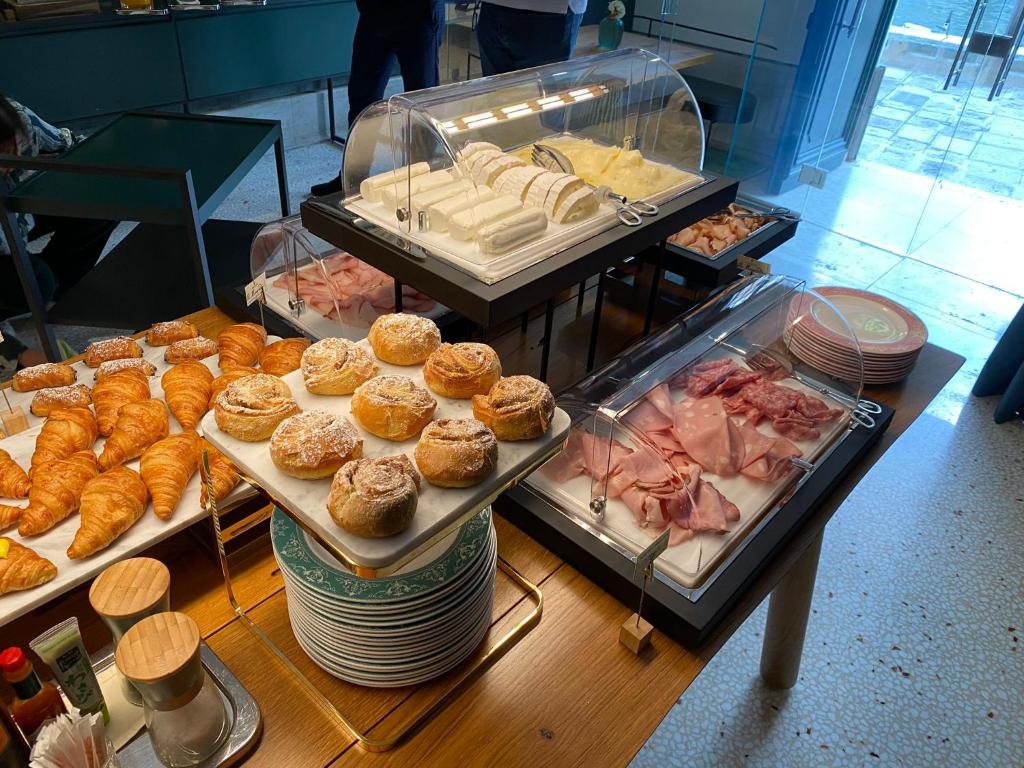 a buffet with different types of food on display at Ca' Bonfadini Historic Experience in Venice