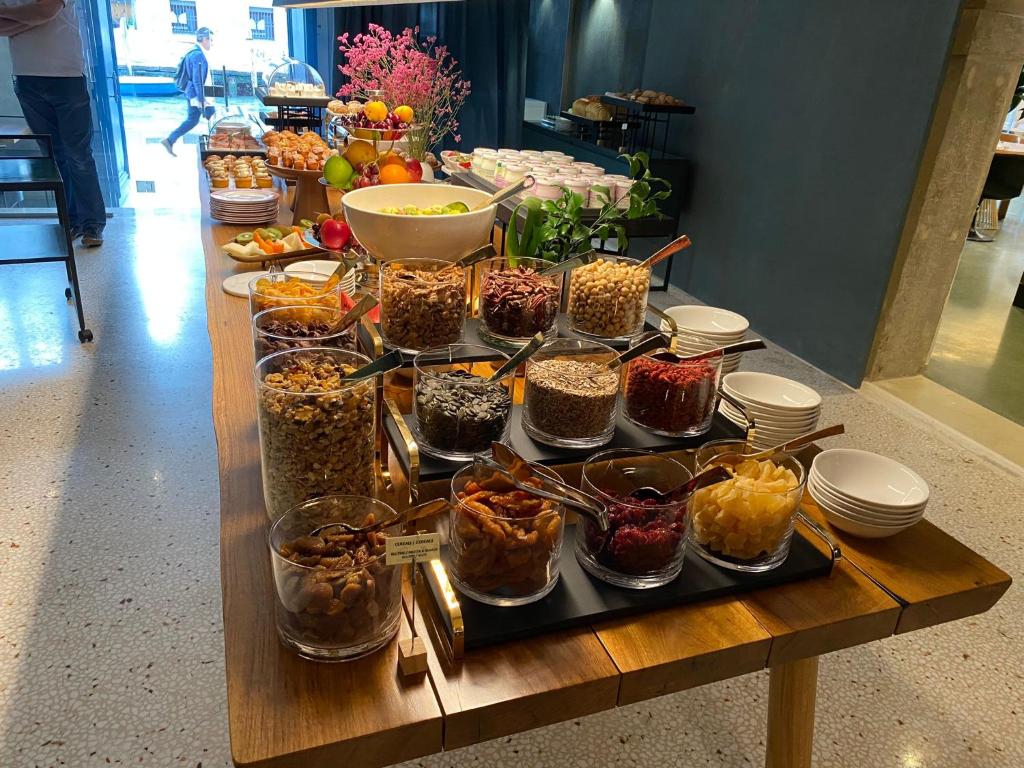 a table with many different kinds of food on it at Ca' Bonfadini Historic Experience in Venice