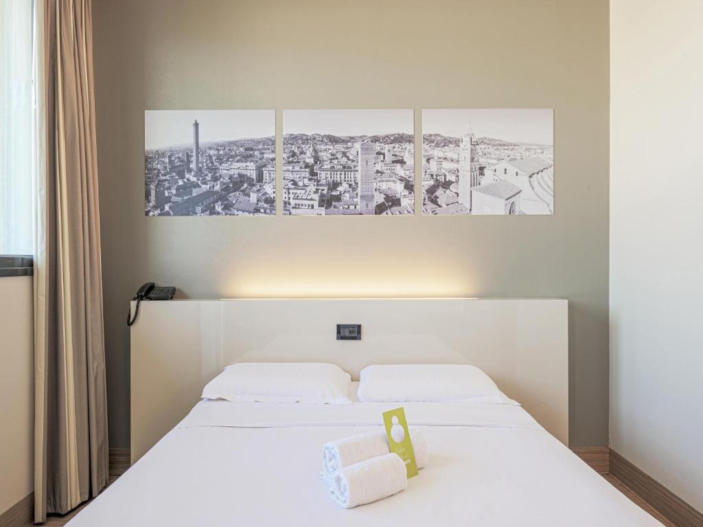 Postel nebo postele na pokoji v ubytování B&B HOTEL Bologna