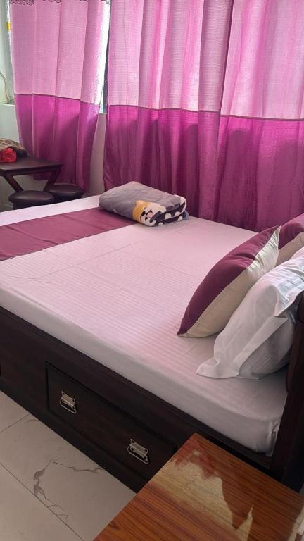 Katil atau katil-katil dalam bilik di Hotel Pema