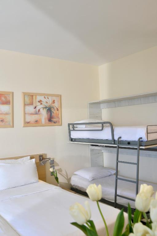 Postel nebo postele na pokoji v ubytování Airotel Achaia Beach