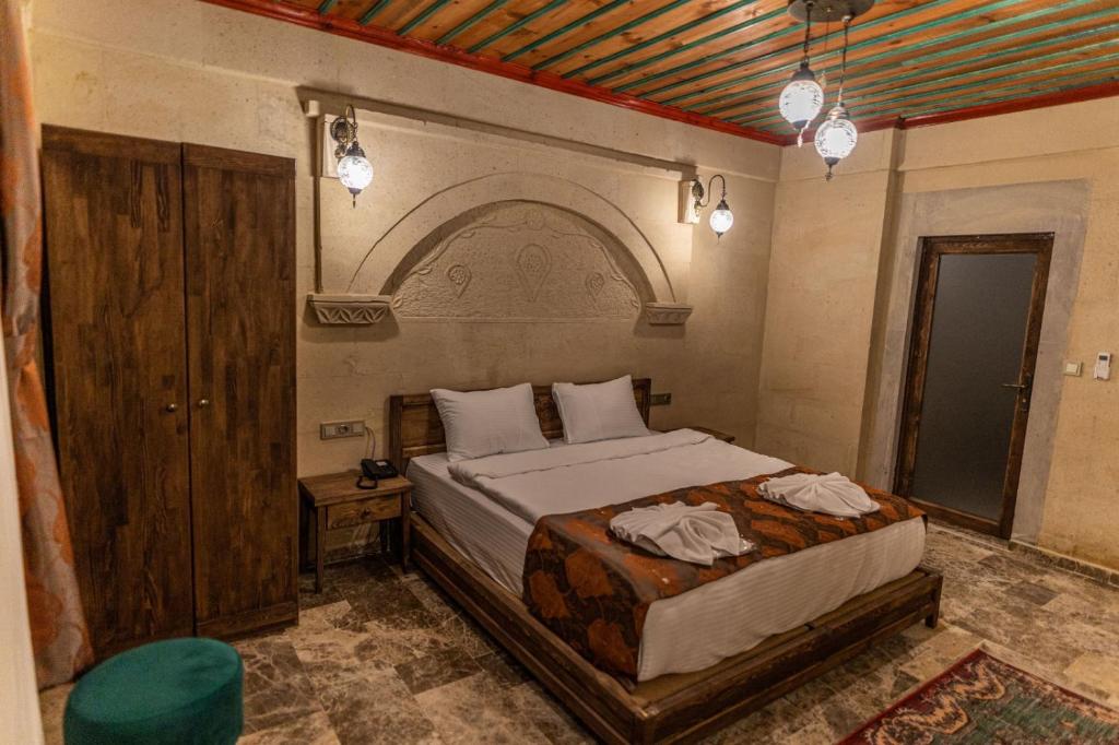 Postel nebo postele na pokoji v ubytování Cordial Cappadocia Hotel
