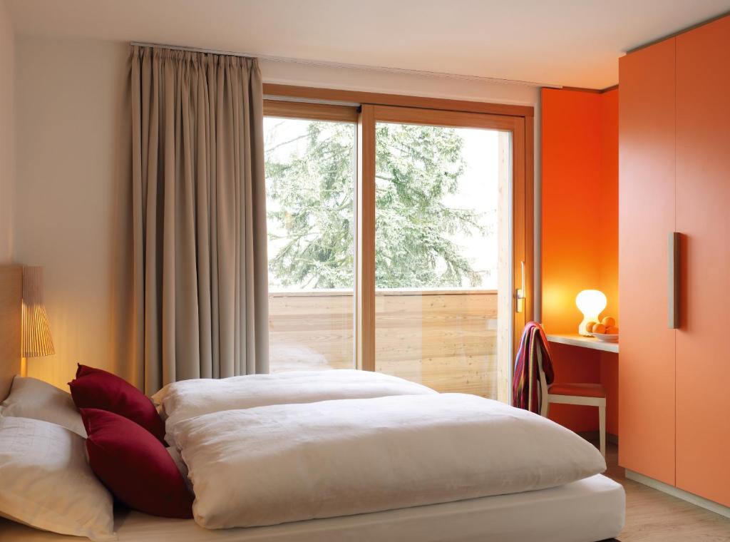 Postel nebo postele na pokoji v ubytování Azalea Park Hotel
