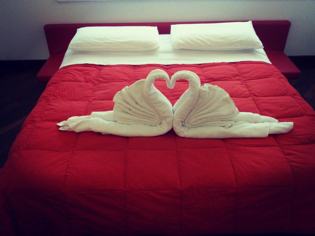 A bed or beds in a room at IL CASTELLO HOSTEL BOUTIQUE