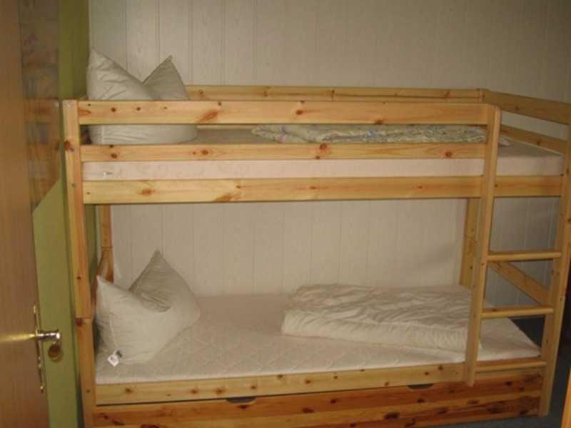 Postel nebo postele na pokoji v ubytování Ferienwohnung am Kreßinsee