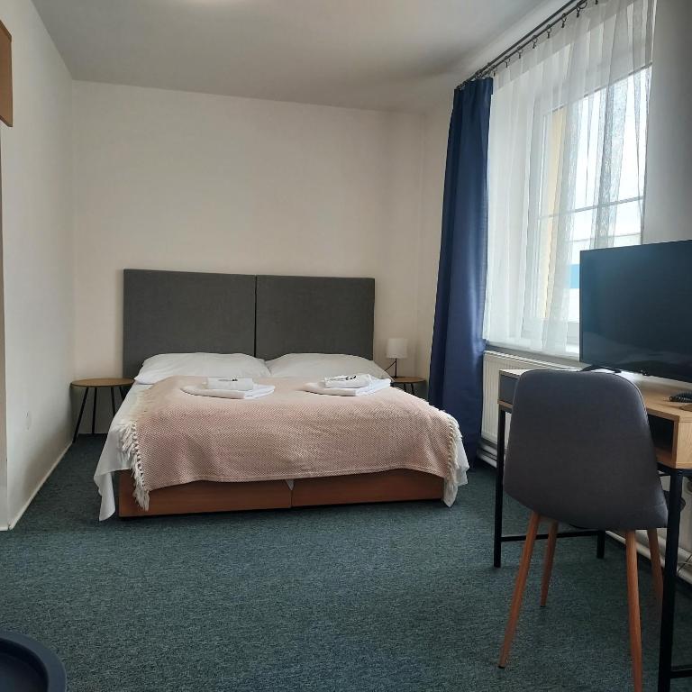 Postel nebo postele na pokoji v ubytování Garni G Hotel Žilina