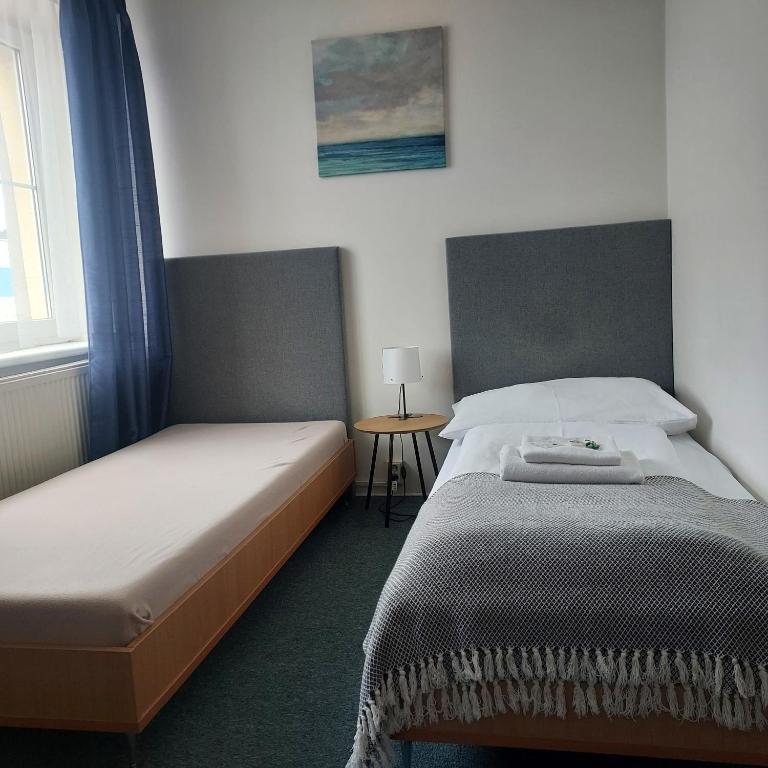 Postel nebo postele na pokoji v ubytování Garni G Hotel Žilina