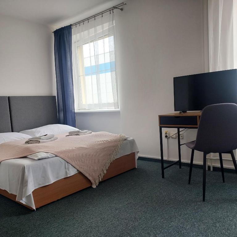 Postel nebo postele na pokoji v ubytování Garni G Hotel Žilina