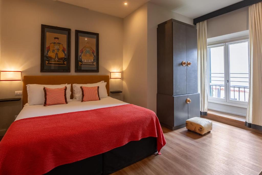 Postel nebo postele na pokoji v ubytování Boutique Hotel Hugo