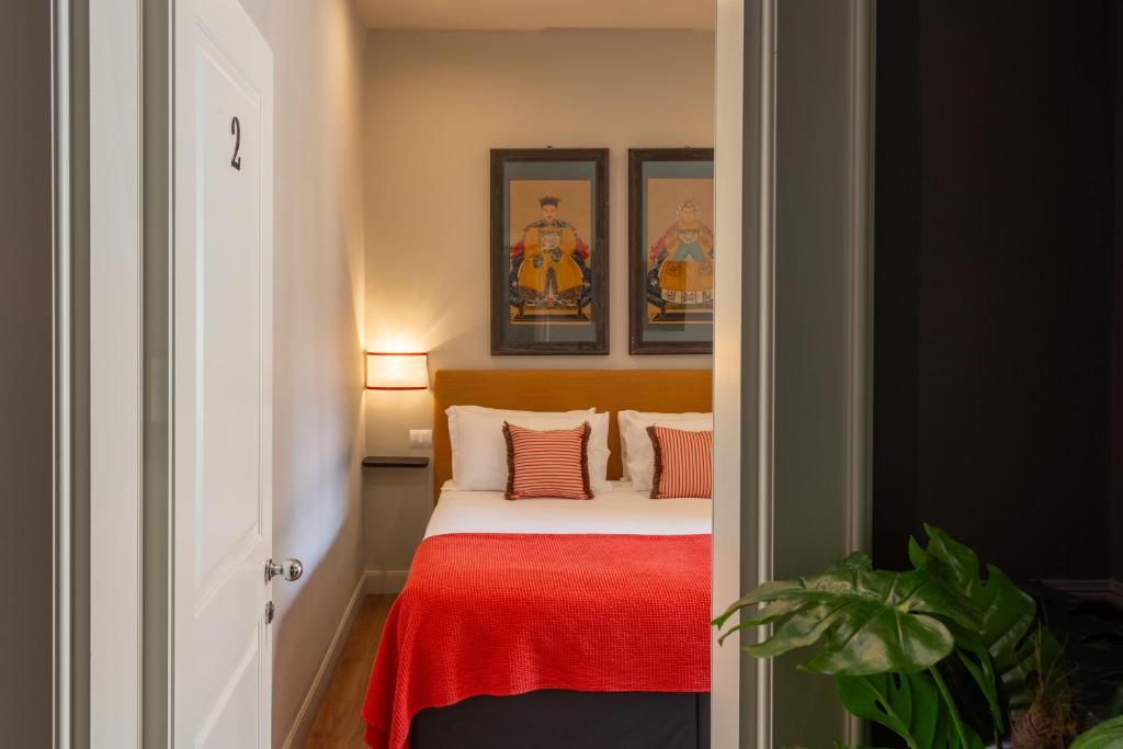 Postel nebo postele na pokoji v ubytování Boutique Hotel Hugo