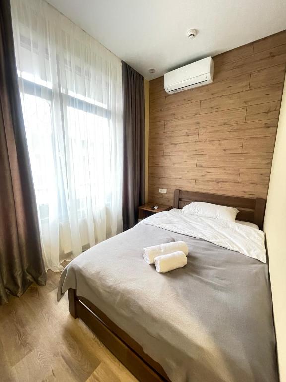 Postel nebo postele na pokoji v ubytování Pierre Apartments