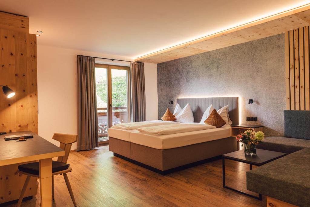 Postel nebo postele na pokoji v ubytování Hotel - Gasthof Märzenklamm