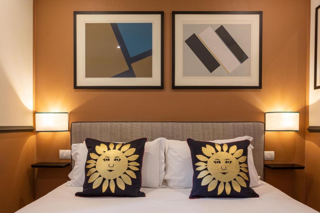 Postel nebo postele na pokoji v ubytování Boutique Hotel Hugo