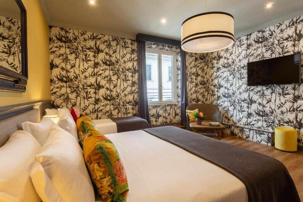 Postel nebo postele na pokoji v ubytování Boutique Hotel Hugo