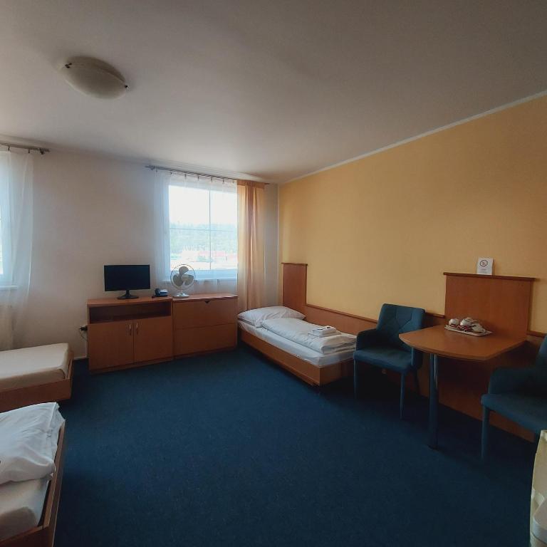 Postel nebo postele na pokoji v ubytování Garni G Hotel Žilina
